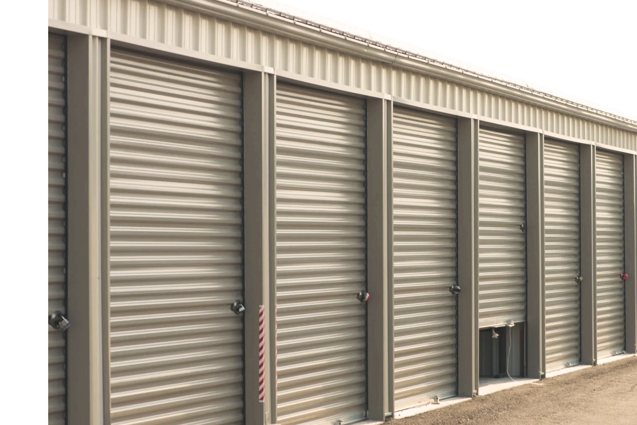Row of closed storage units that are clean and safe. Self serve storage units best priced storage in ogden.