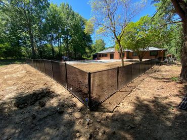 Double picket fence. Good for small dogs and meets pool code.