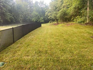 Double picket fence. Good for small dogs and meets pool code.