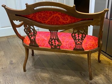 Antique settee with filigree back and reupholstery in Thai silk