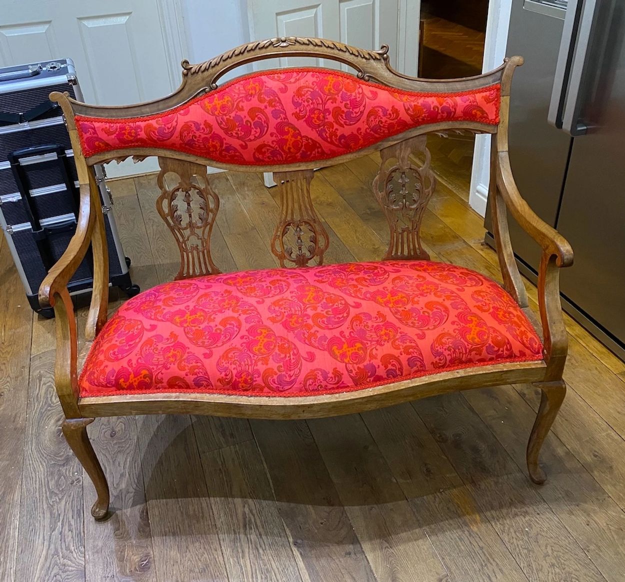 A beautiful Victorian Settee with Filigree back, covered in Thai silk. 

Just as beautiful from the 