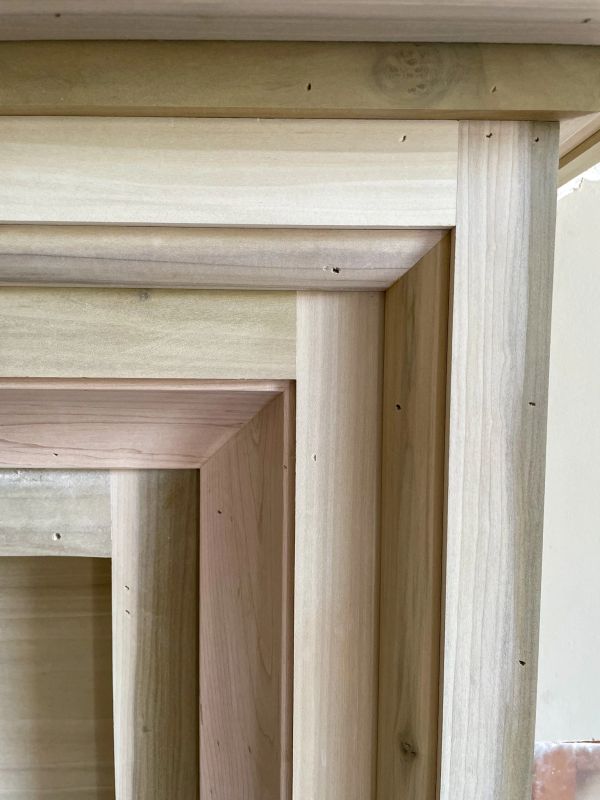 Close-up of stacked wooden frames.