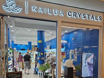 Entrance of Kailua Crystals store with blue interior and crystal displays.