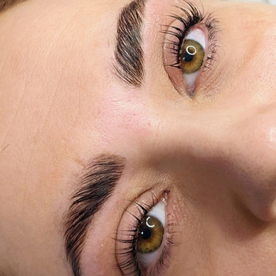 Green-eyed lady with Lifted Lashes and Laminated Brows.