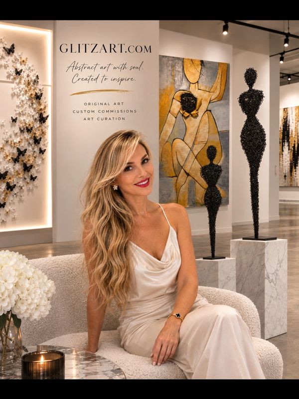 Woman in white dress sitting in an art gallery.