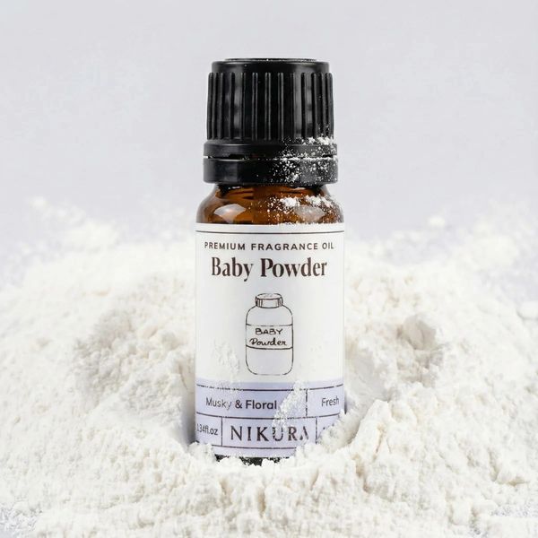 Bottle of Baby Powder fragrance oil in white powder.
