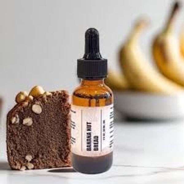 Banana nut bread slice next to a dropper bottle.