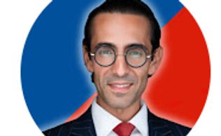 Professional man in suit with glasses and red tie.