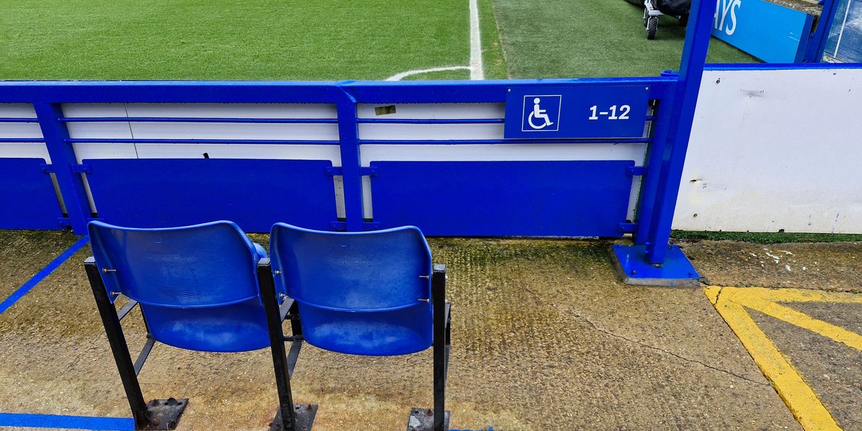 A wheelchair bay and personal assistant's seat in the West Stand at Kingsmeadow