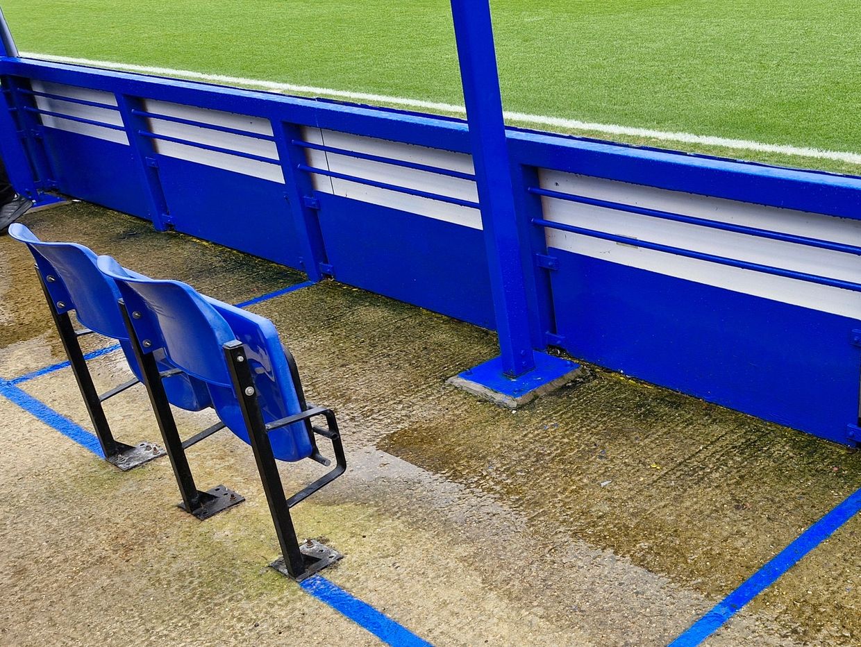 A wheelchair bay and personal assistant's seat in the West Stand at Kingsmeadow