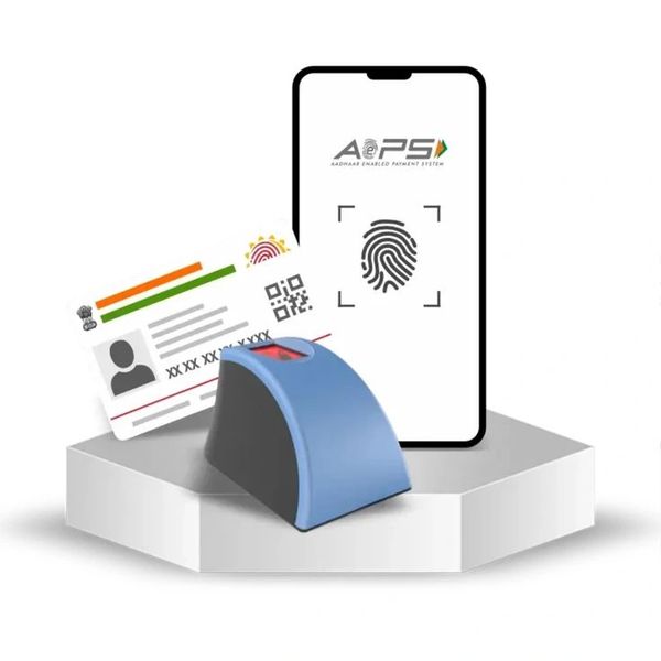 Aadhaar card with fingerprint scanner and mobile showing AePS app.
