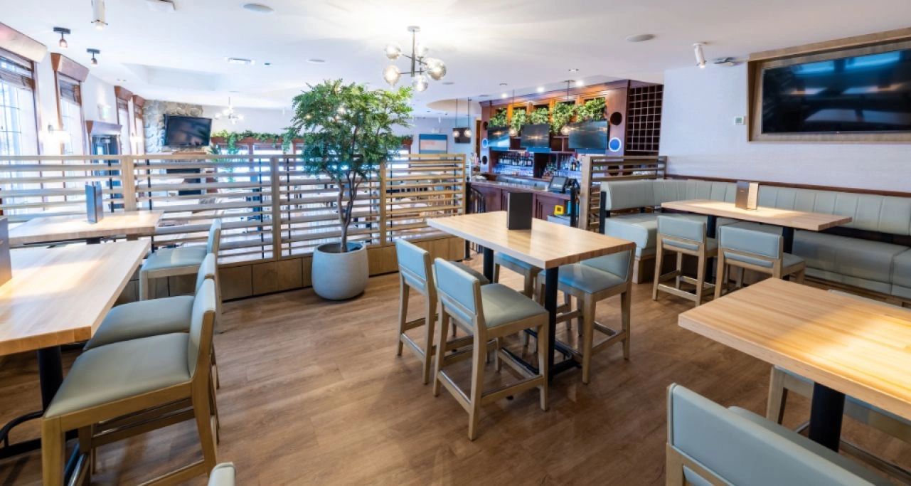 Modern restaurant dining area with custom millwork furniture and wood finishes, Moxies Prince George