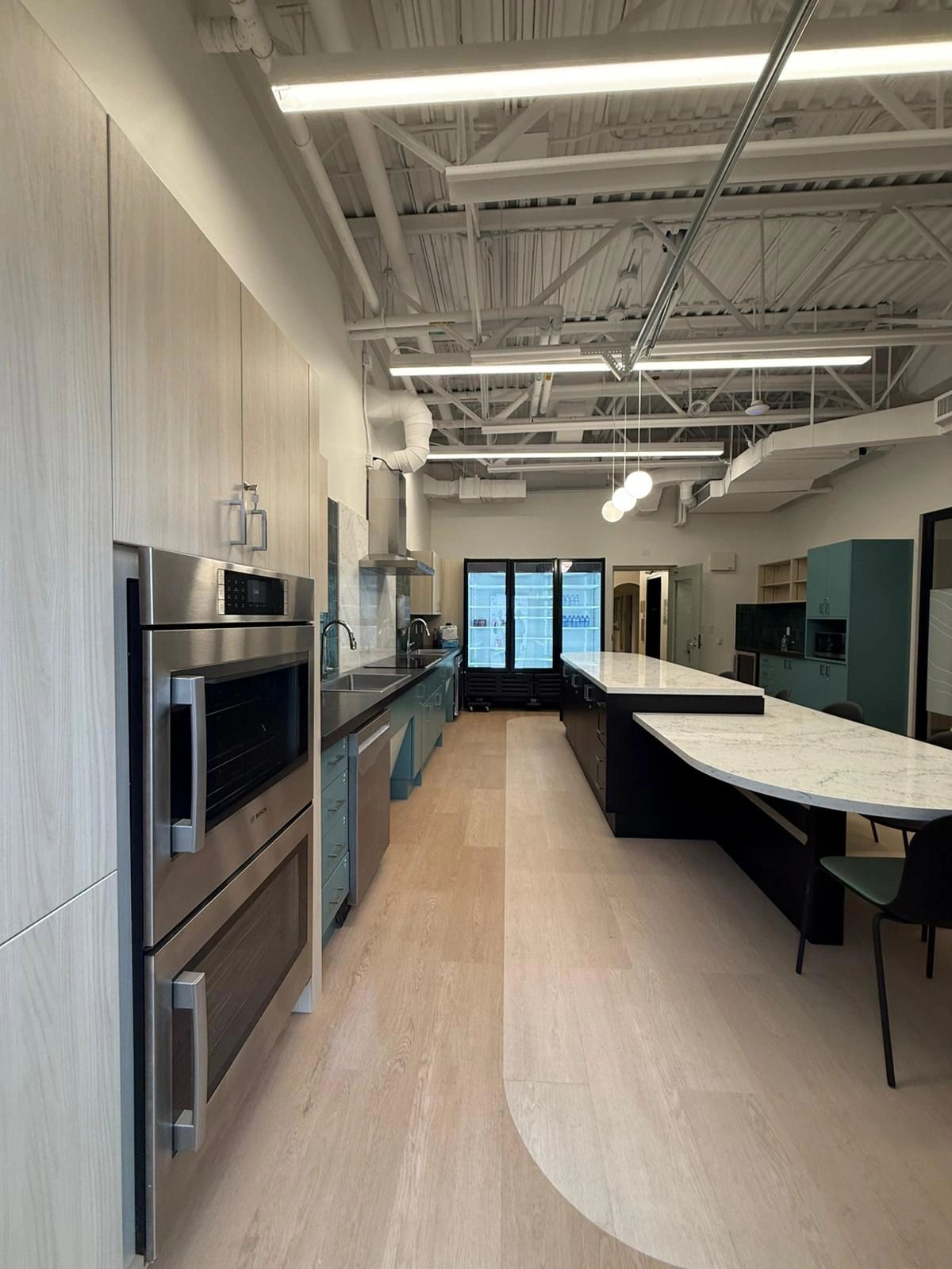 Custom millwork installation with cabinetry and wall panels in Vancouver, BC