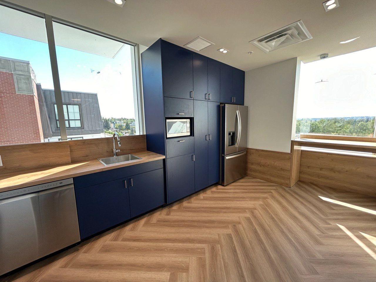 Custom millwork installation with cabinetry and wall panels in Vancouver, BC. 