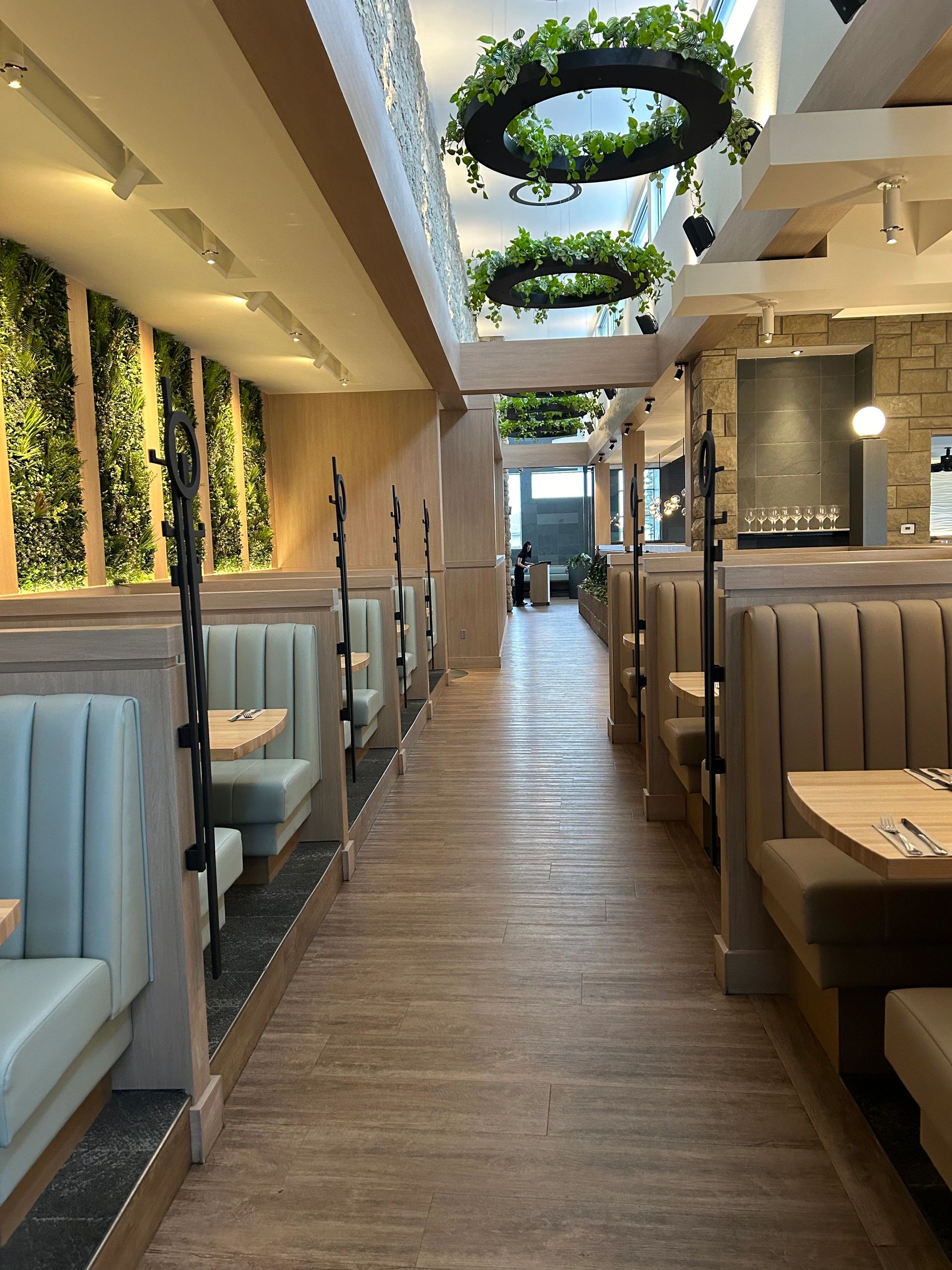 Custom millwork installation with wood wall panels and cabinetry in Regina, SK.
