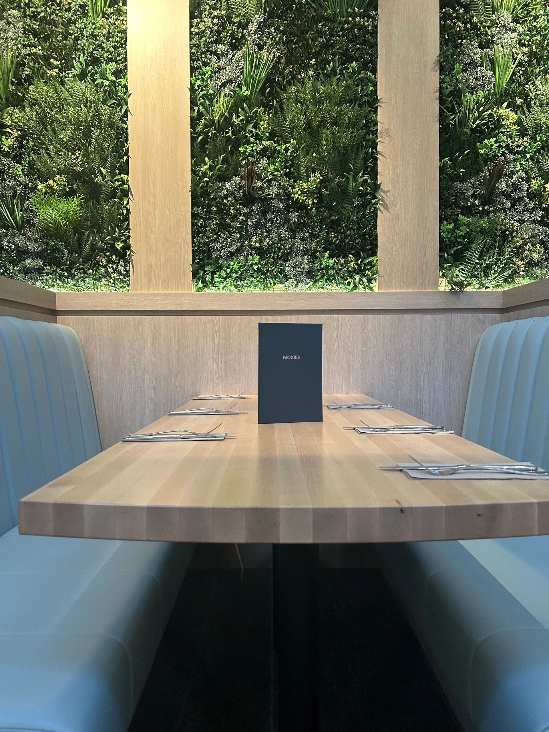 Custom millwork installation with wood wall panels and cabinetry in Regina, SK.