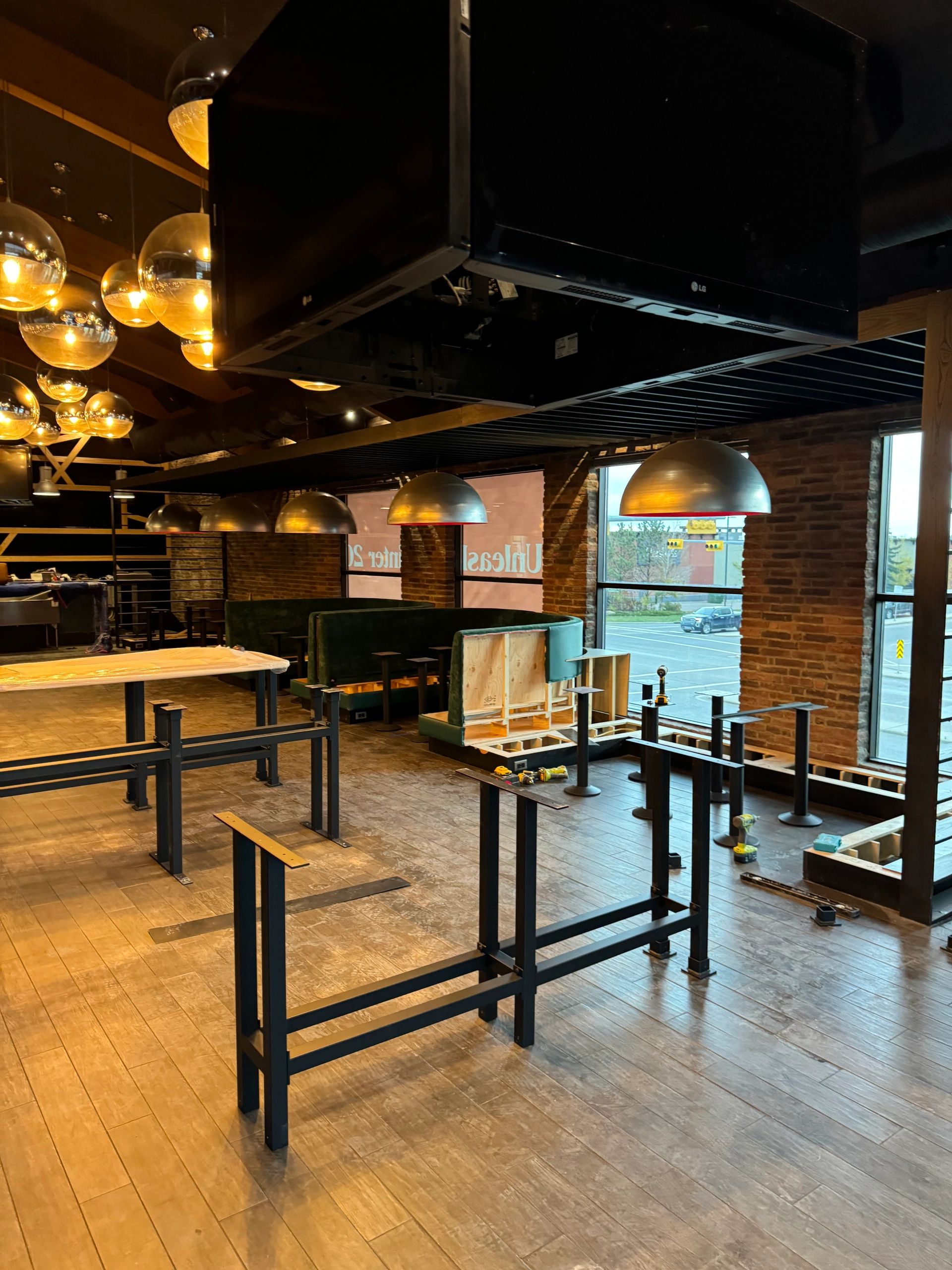 Custom millwork installation with wood wall panels and cabinetry in Calgary, AB.