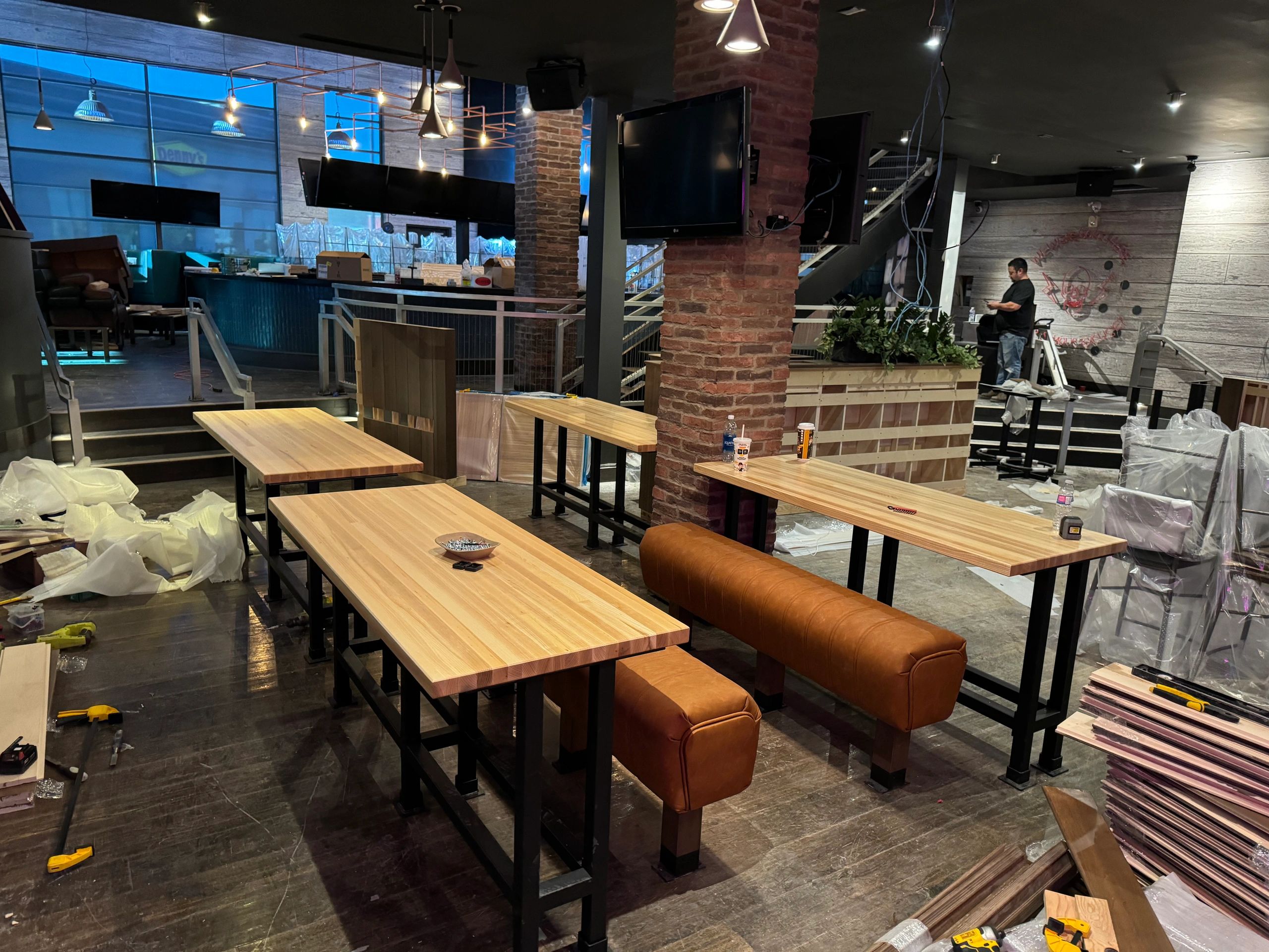 Custom millwork installation with wood wall panels and cabinetry in Calgary, AB