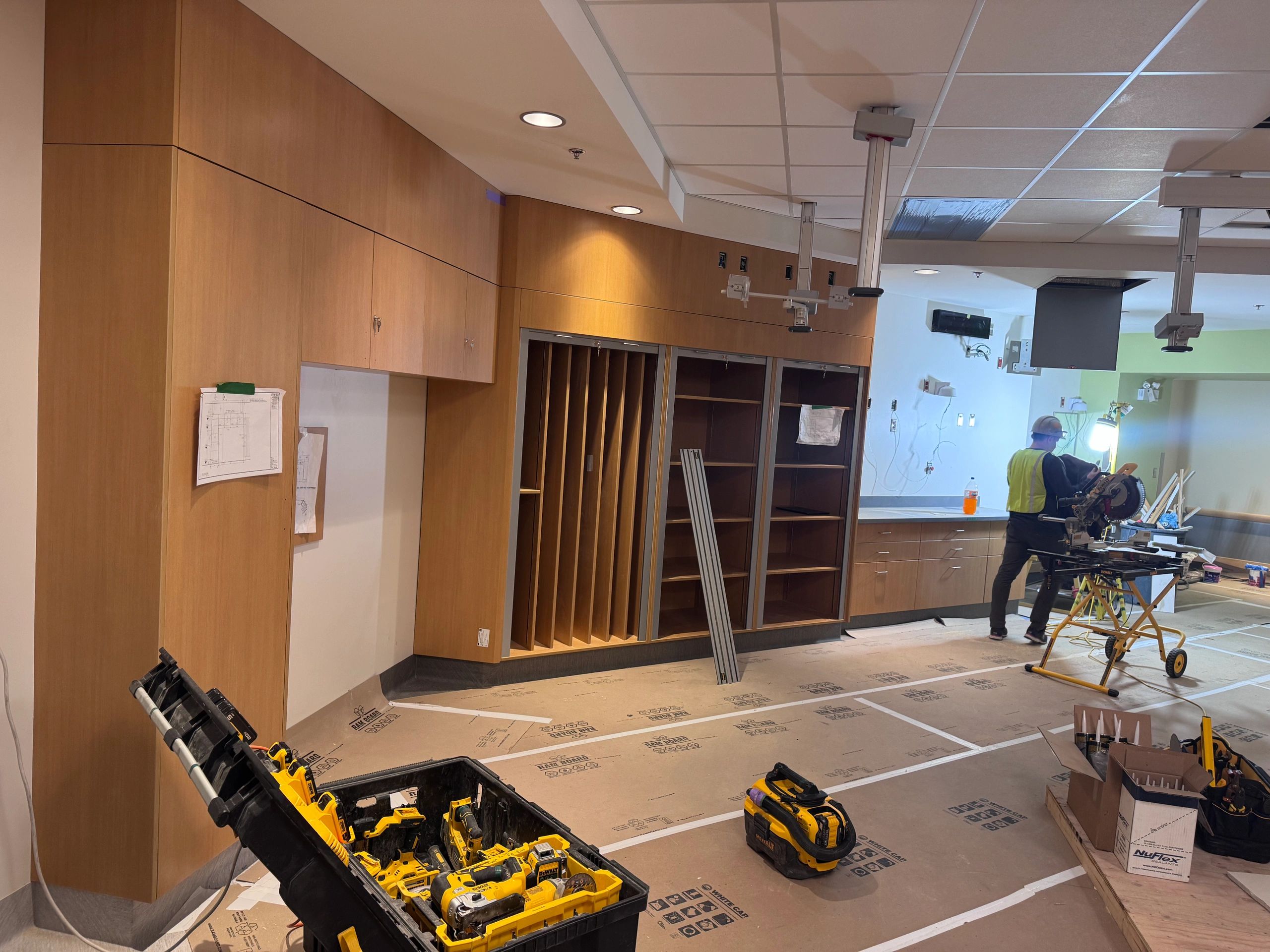 Hospital millwork installation in progress with custom cabinets and shelving Prince George BC