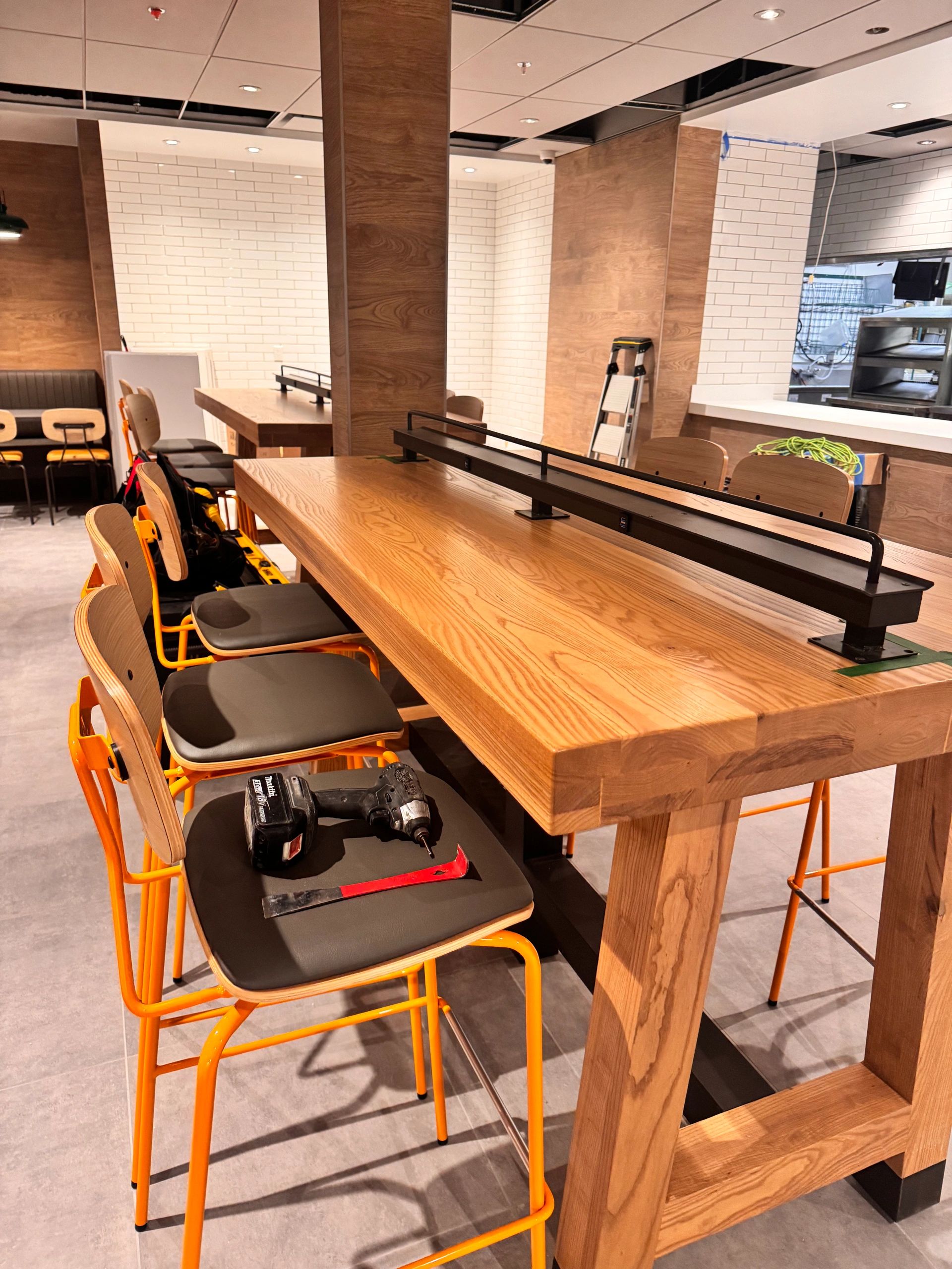 Custom millwork installation with cabinetry and wall panels in Vancouver, BC.