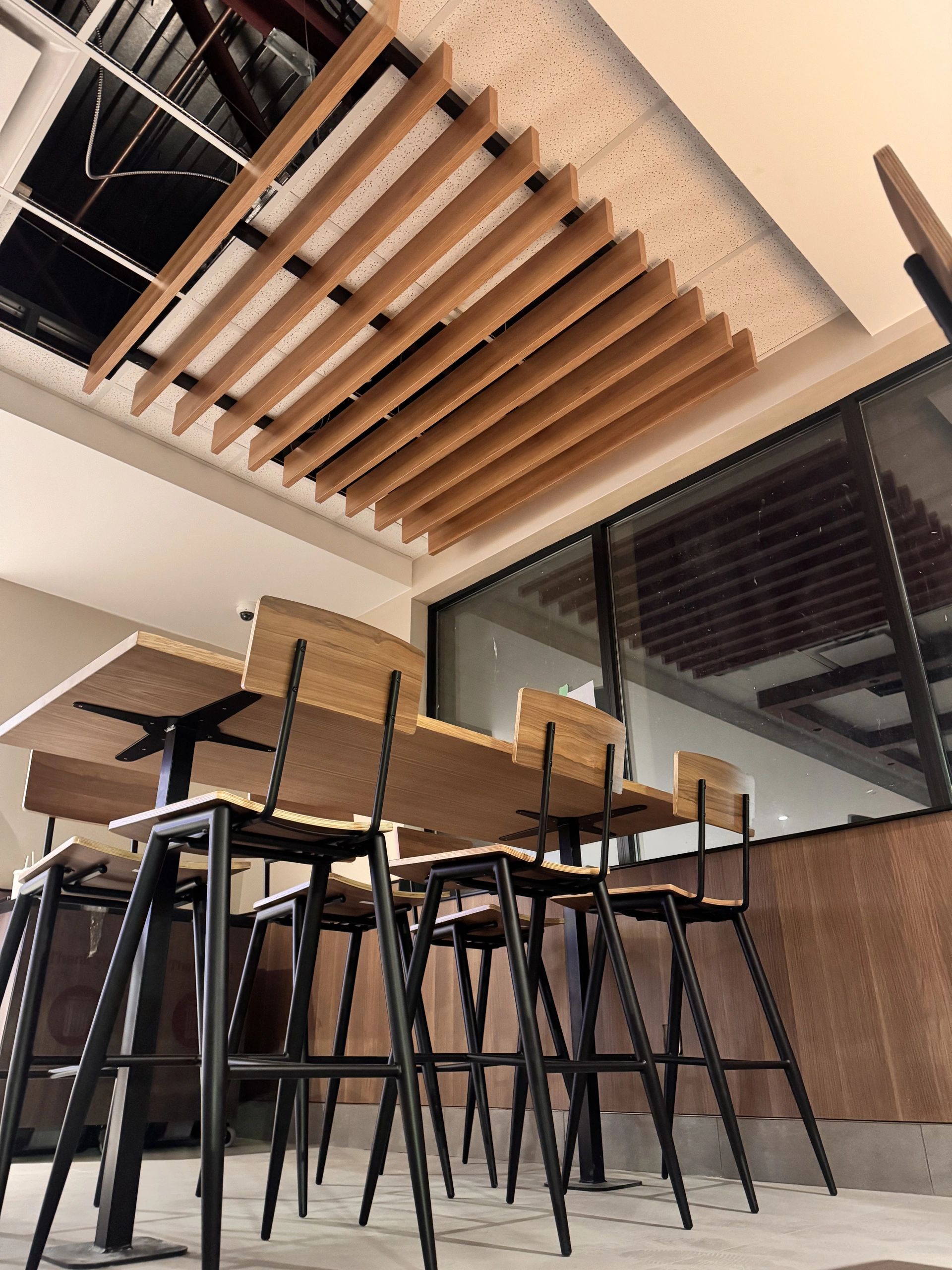 Commercial millwork installation featuring custom wood finishes in Vancouver