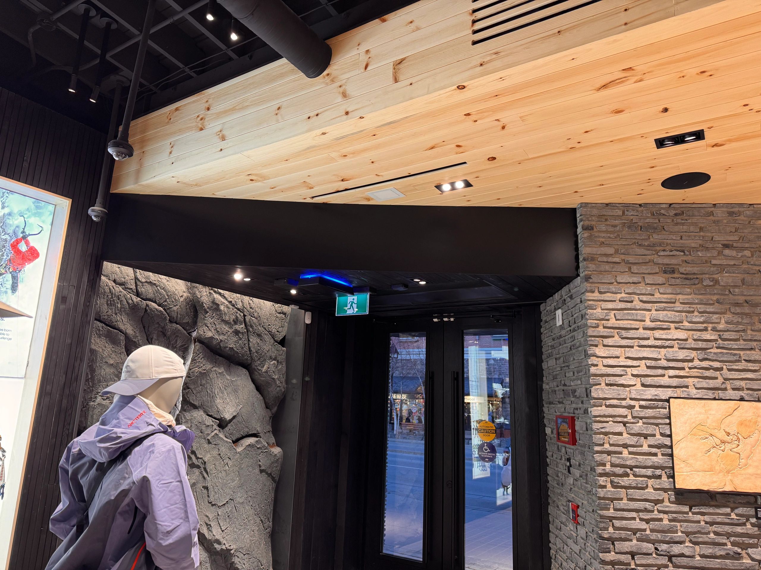 Retail millwork installation with display cabinetry and wood paneling in Banff, AB.