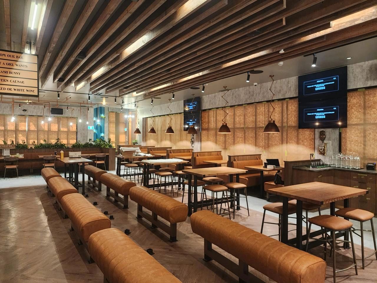 Wood slat ceiling installation, custom commercial millwork project in restaurant interior