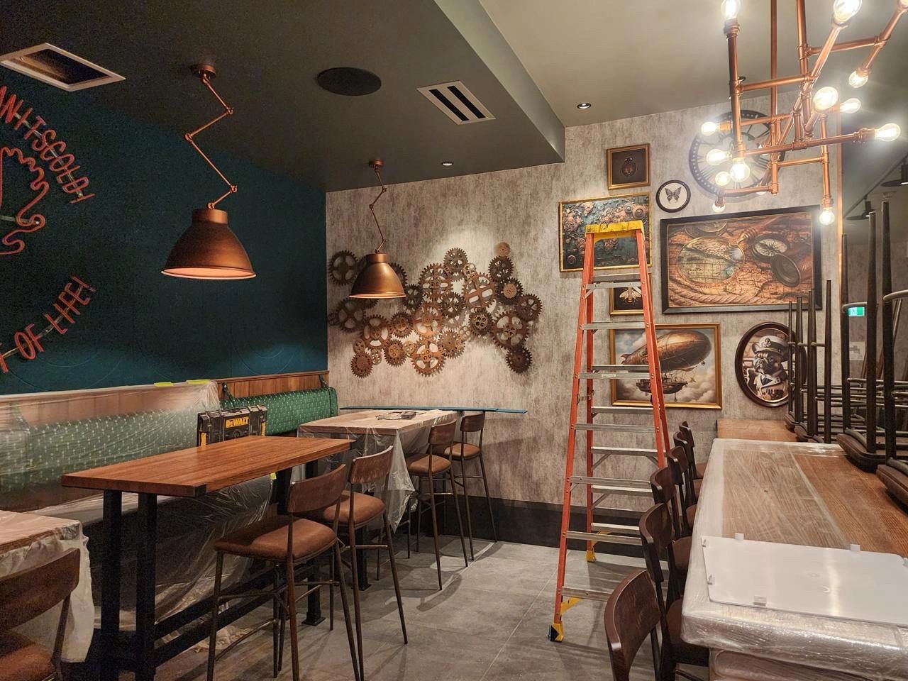 Restaurant interior with custom millwork wall panels, lighting fixtures and wood furniture