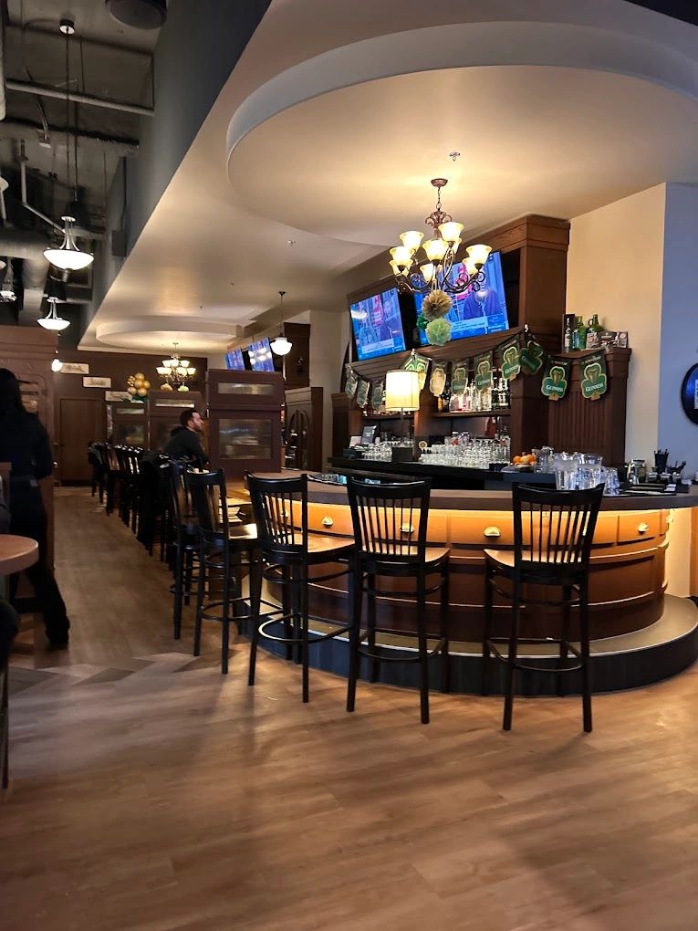 Custom millwork installation with wood wall panels and cabinetry in Edmonton, AB.