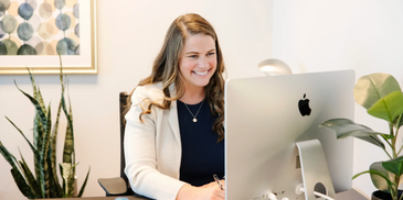 Woman smiling on telehealth call.