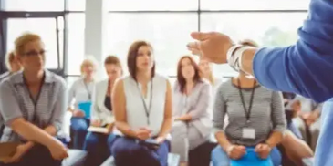 A group of people listening to a seminar.