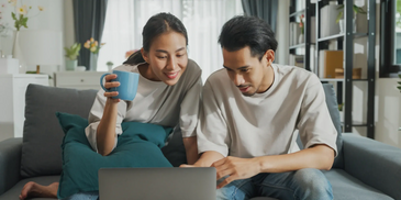 A couple looking at health resources on the computer.