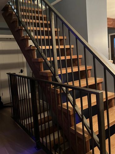 Floating staircase with cusstom built metal handrail