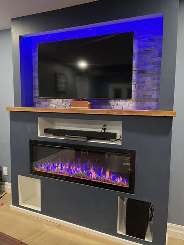 Custom entertainment unit with built in electric fireplace