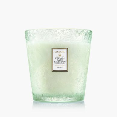 Voluspa French Cade Lavender scented candle in a textured glass container.