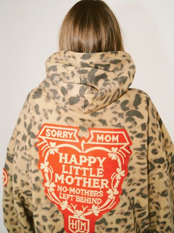 Person wearing a leopard print hoodie with a red and white Mother's Day message on the back.