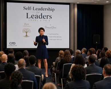 A woman presents on self-leadership to a professional audience.