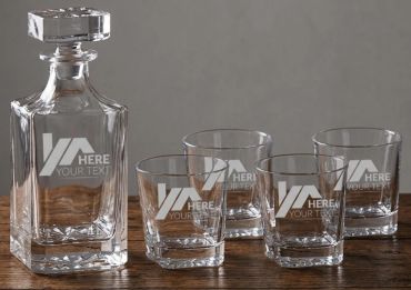 Elegant glass decanter set with four matching glasses.