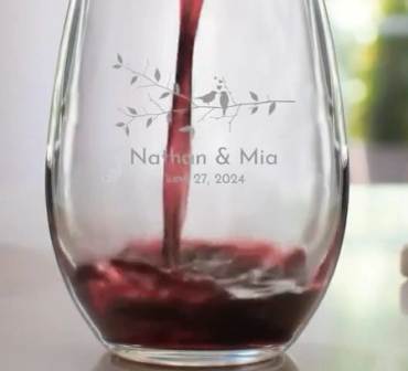 Wine being poured into a personalized engraved glass.