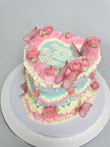 Classically Elegant Birthday Cake with Butterflies, Florals, and Rope Piping for Mom. 