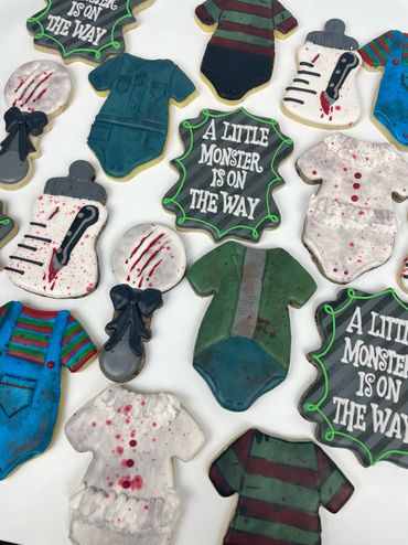 Horror Themed Baby Shower Cookies with Scary Rattle, Bottle, and Character Themed Onesies