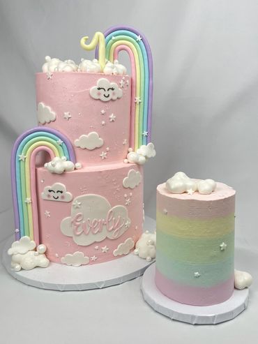 Rainbow 1st Birthday Cake with Smiling Clouds and Matching Ombre Rainbow Smash Cake. 