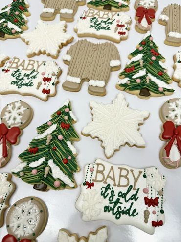 Baby It's Cold Outside Baby Shower Cookies with Snowflakes, Onesies, Christmas, Trees, and Rattle.