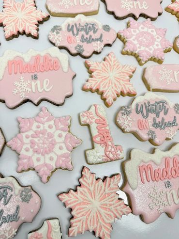 Winter Onederland Birthday Cookies with Pink and Snowy Theme. Includes Snowflakes, and  Number One. 