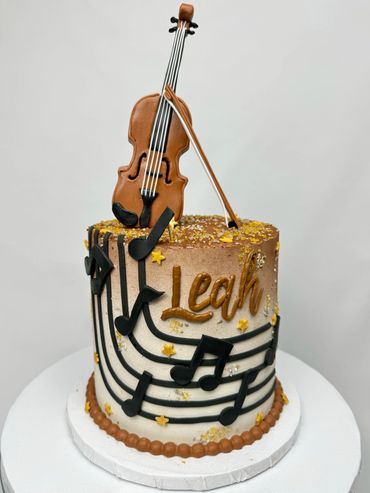 Violin Inspired Birthday Cake with Music Notes, and Violin Top with Bow. Brown Colors and Gold Stars