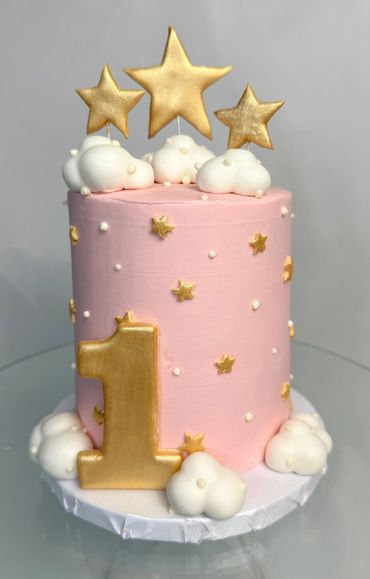 Twinkle Little Star Themed Birthday Cake with Pink base and fluffy clouds with gold stars