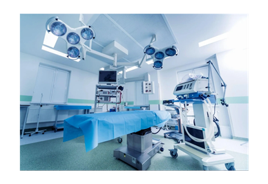 A modern, sterile operating room with surgical equipment and bright lights.