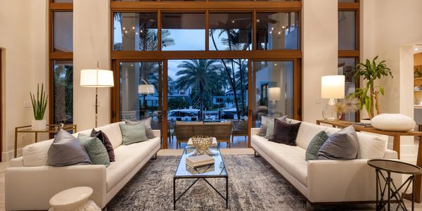 Elegant living room with large windows and ocean view.