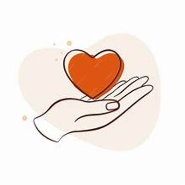 Hand holding a red heart symbolizing care and love.