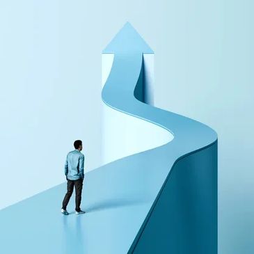 Man facing a winding arrow path upward.